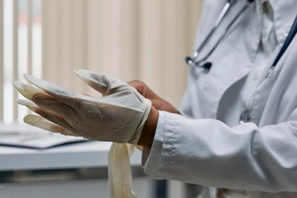 Doctor wearing latex gloves