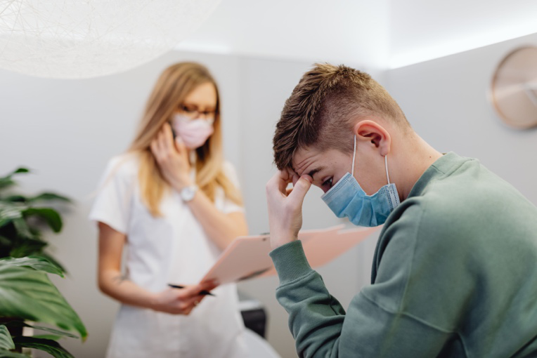 Patient discussing digestive symptoms and possible liver health concerns with a gastroenterologist.
