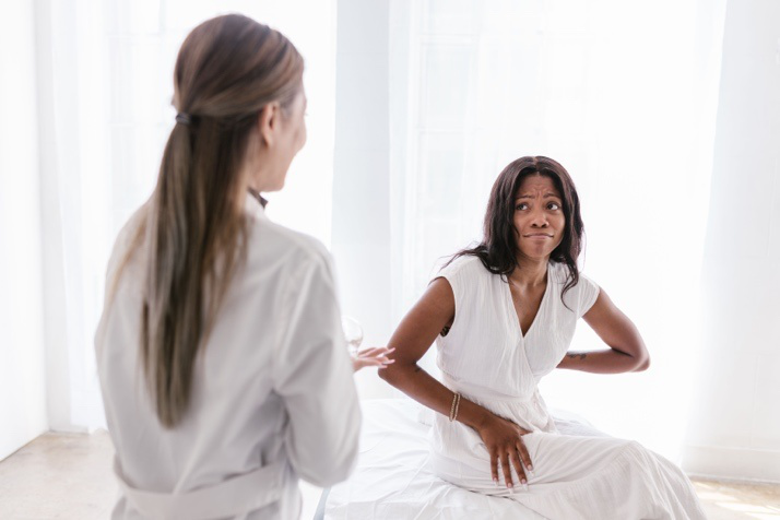 Doctor discussing bowel habit changes and digestive health concerns with a patient in a gastroenterology clinic.