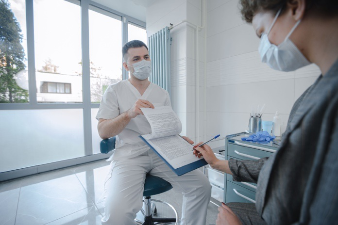 Patient reviewing colonoscopy preparation instructions before a scheduled digestive health screening.