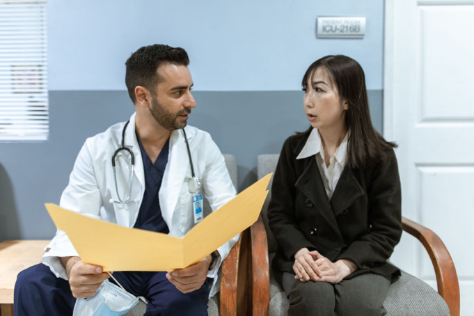 Doctor discussing liver health concerns and diagnostic options with a patient.