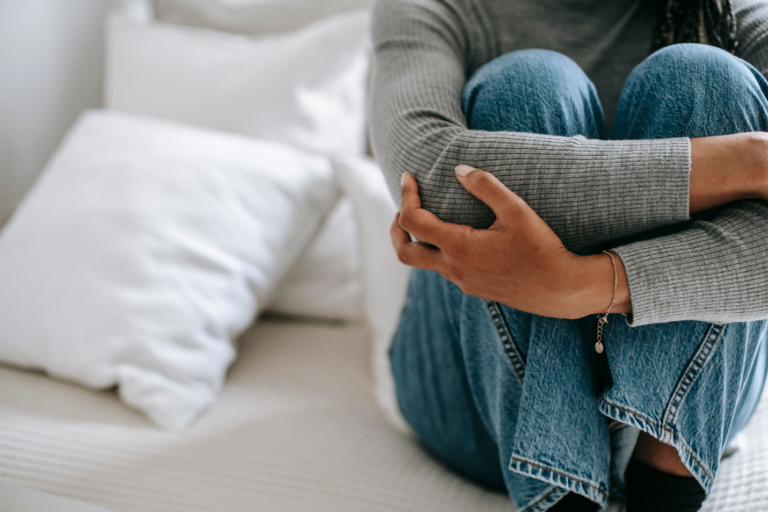 Woman sitting alone in distress